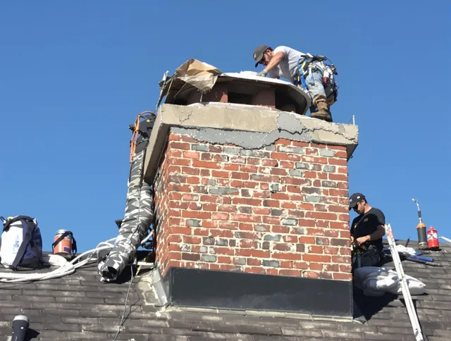 Temescal Valley Chimney Sweep installing a custom chimney crown in Temescal Valley, CA