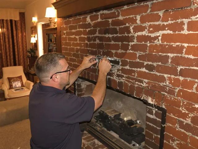 Temescal Valley Chimney Sweep expert fixing a fireplace in Temescal Valley, CA